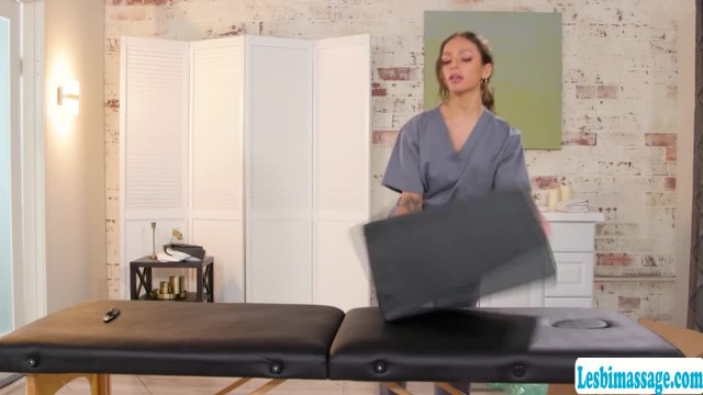 Hot masseuse uses new bolster to client