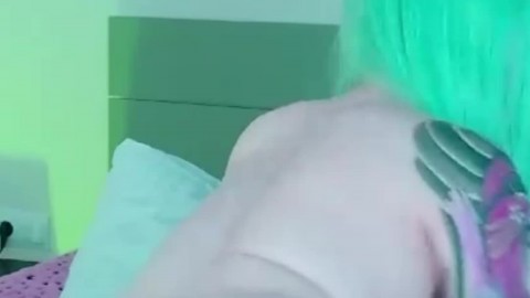 Naughty Green-Haired Camgirl Secretly Fingers Her Plugged Ass